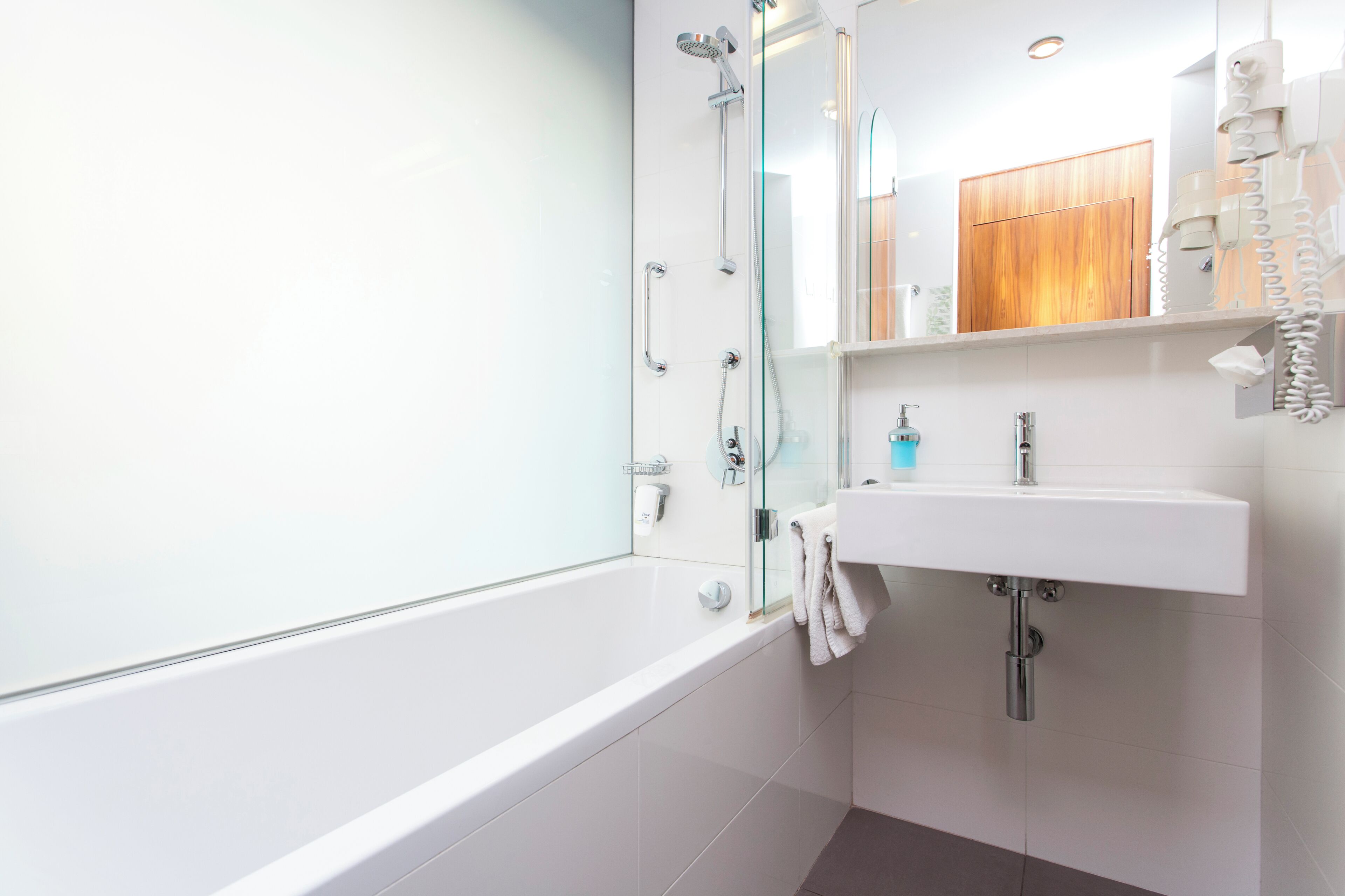 executive suite | bathroom | hair dryer, towels, soap, shampoo