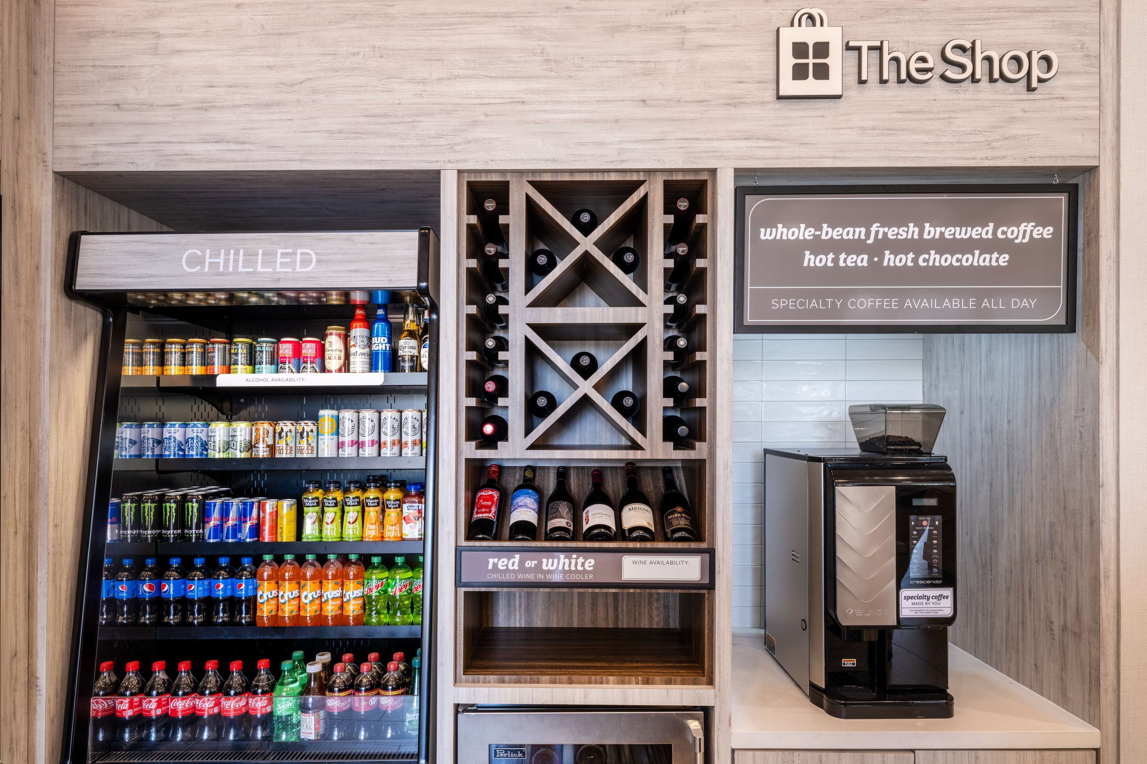 A beverage vending machine with a 'CHILLED' section, a wine cooler, and a specialty coffee machine.