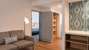 Deluxe Suite, 3 Bedrooms | Living area | Flat-screen TV, pay movies