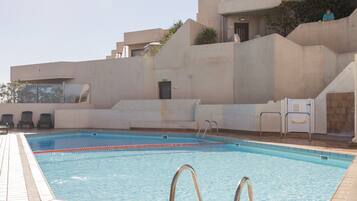 Seasonal outdoor pool, pool loungers