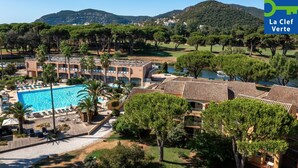 A hotel with a swimming pool, multiple buildings, and surrounding greenery. - Pierre & Vacances Residence Cannes Mandelieu (Mandelieu-La-Napoule)