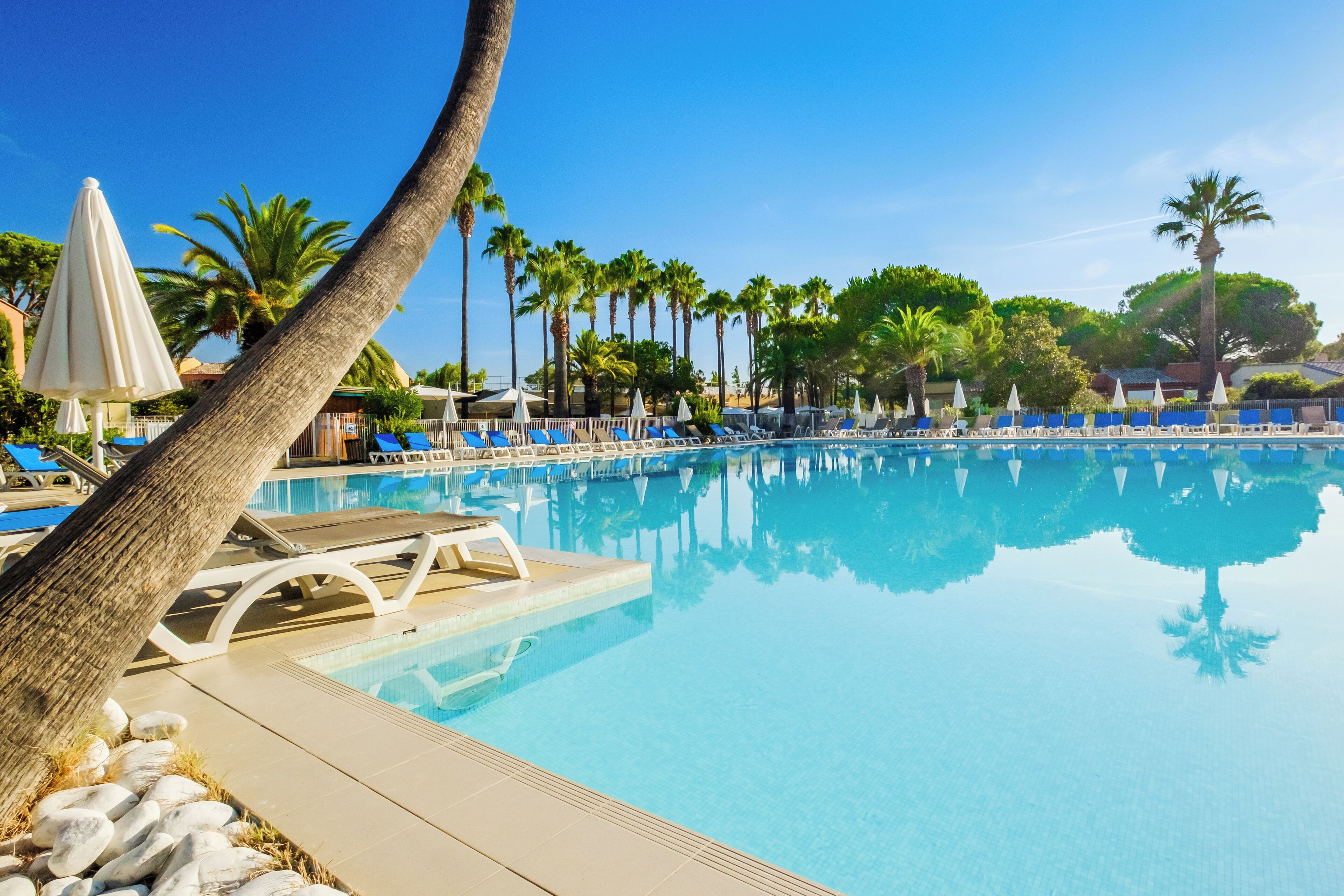 Seasonal outdoor pool, pool umbrellas, pool loungers