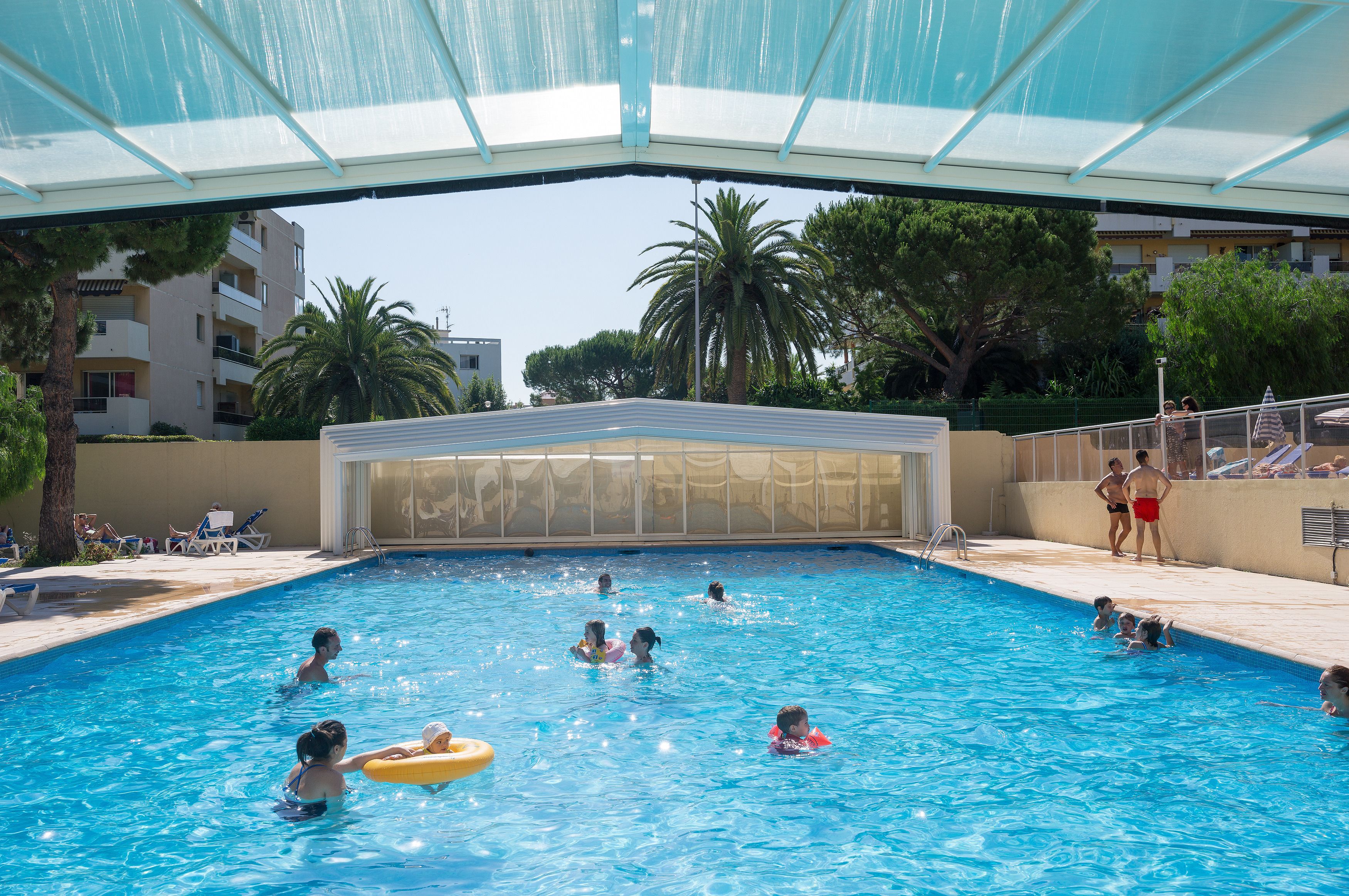 Seasonal outdoor pool, pool loungers