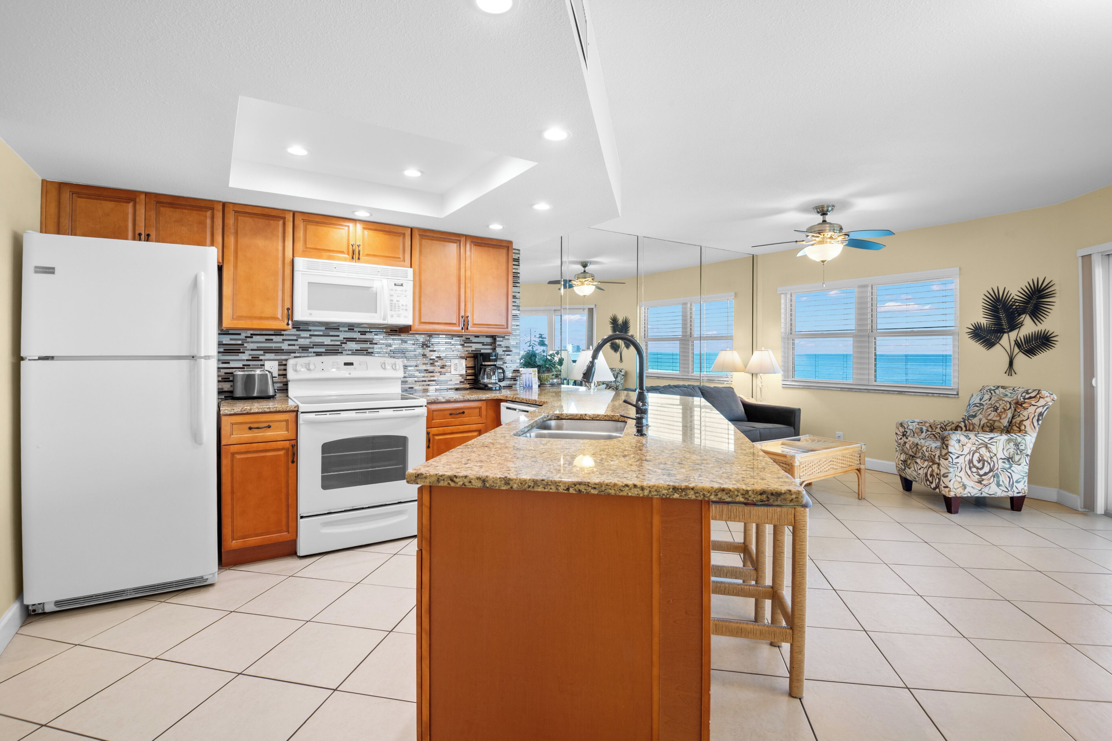 Deluxe Condo, Ocean View | Private kitchen | Full-size fridge, microwave, stovetop, dishwasher