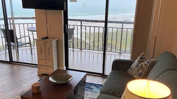 Deluxe Condo, Beach View | Living area | Flat-screen TV, DVD player