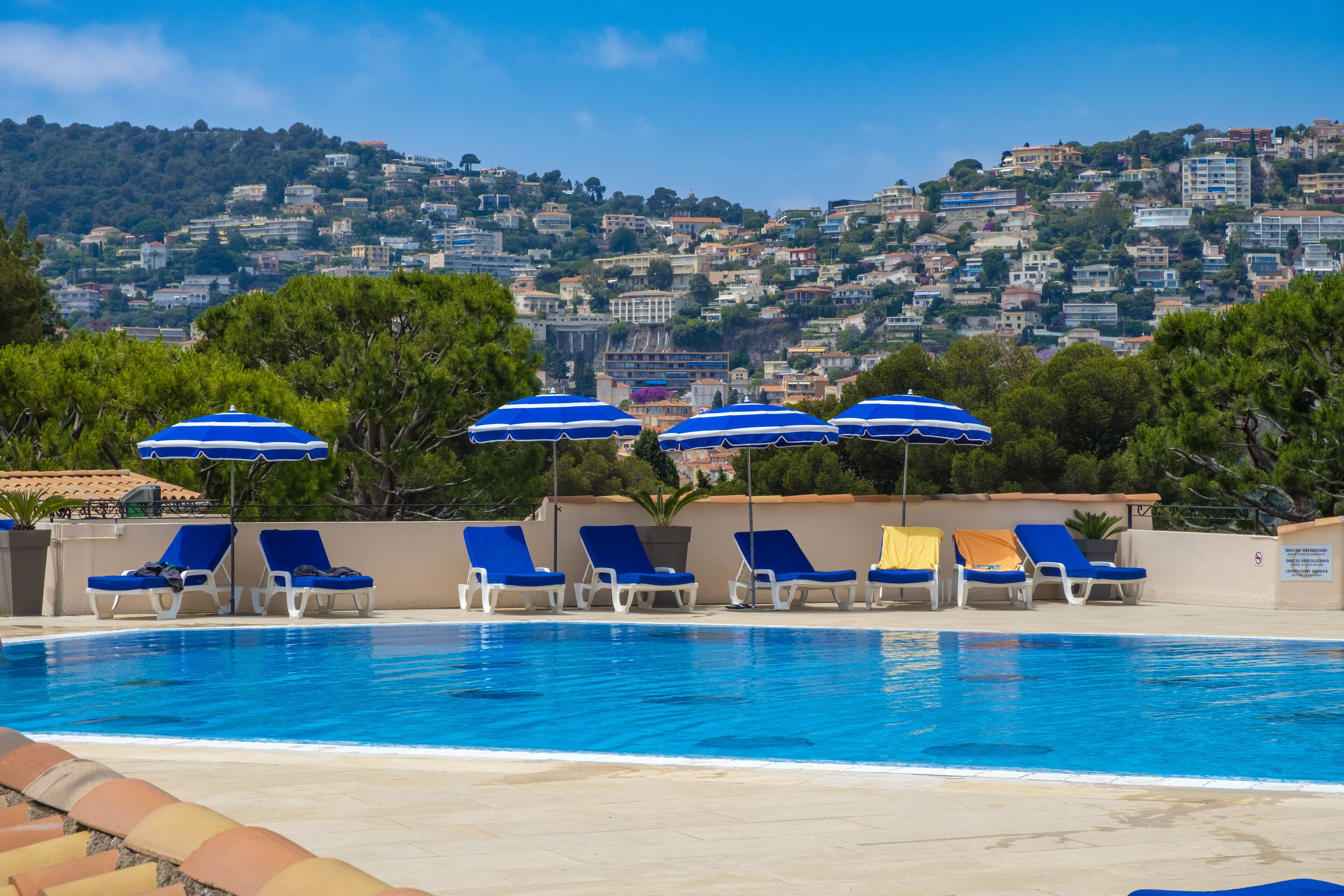 Seasonal outdoor pool, pool umbrellas, pool loungers