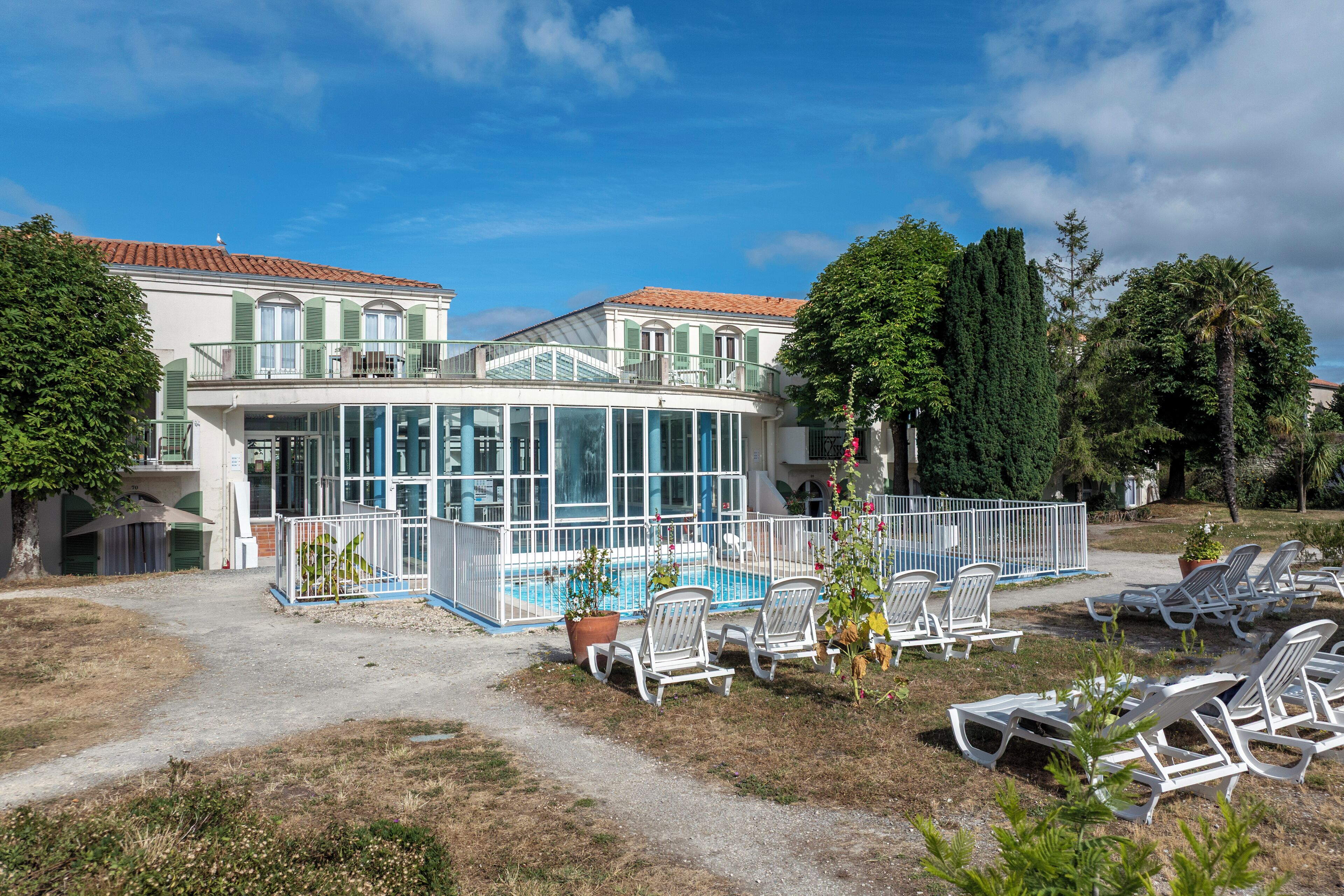 Indoor pool, open 9:00 AM to 7:00 PM, pool loungers