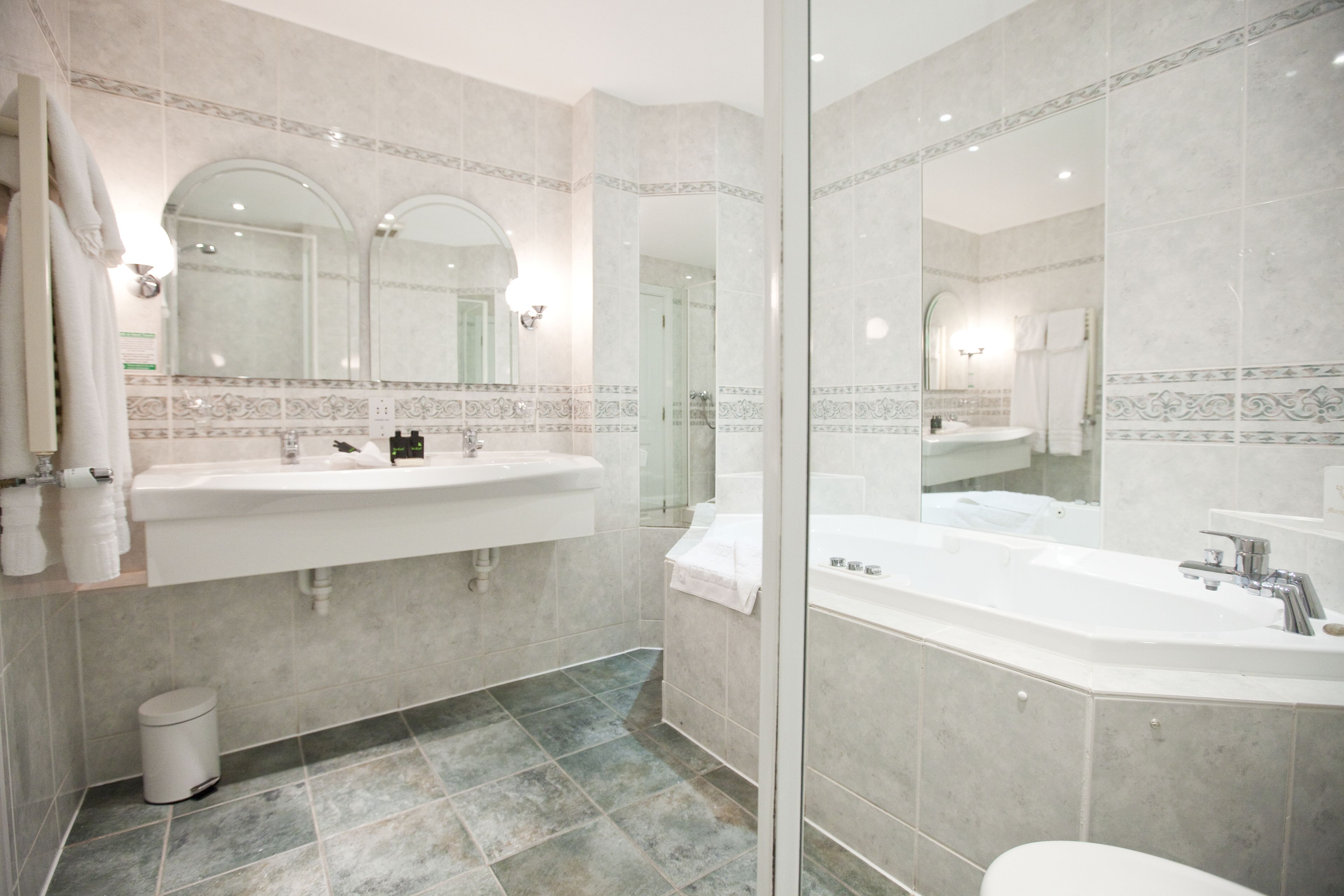 executive suite | bathroom | combined shower/bathtub, designer toiletries, hair dryer, towels