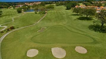 Golfers can enjoy a serene round amidst lush greenery and challenging holes.