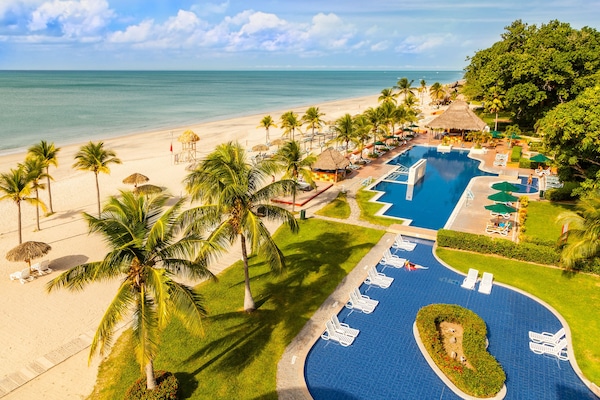 On the beach, white sand, free beach cabanas, sun loungers