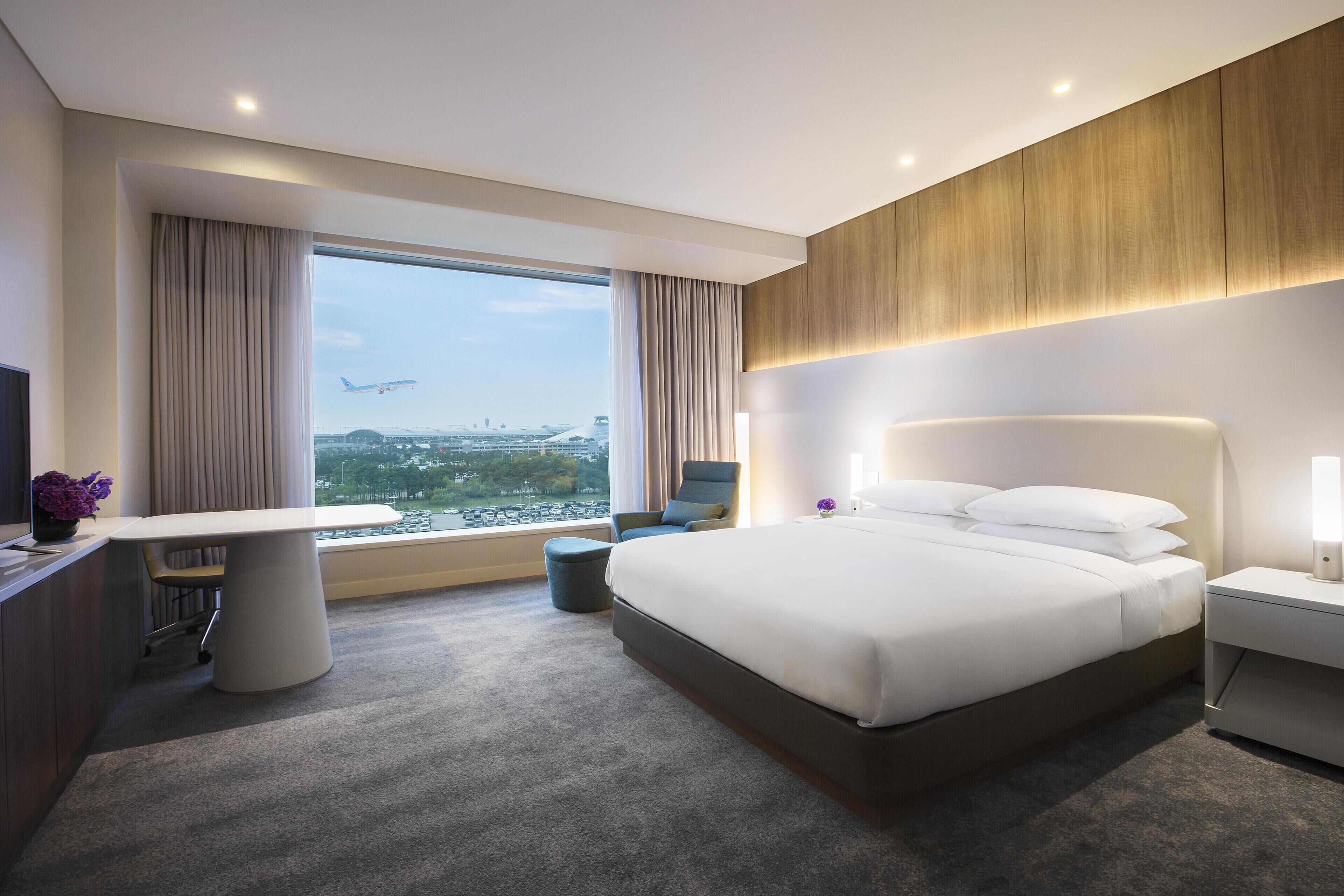Room, 1 King Bed (West Tower, Airport View) | Premium bedding, down comforters, minibar, in-room safe