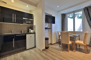 Apartment | Private kitchen | Fridge, microwave, stovetop, cookware/dishes/utensils