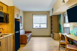 Suite, 1 Queen Bed, Non Smoking | Desk, blackout curtains, iron/ironing board, free cots/infant beds