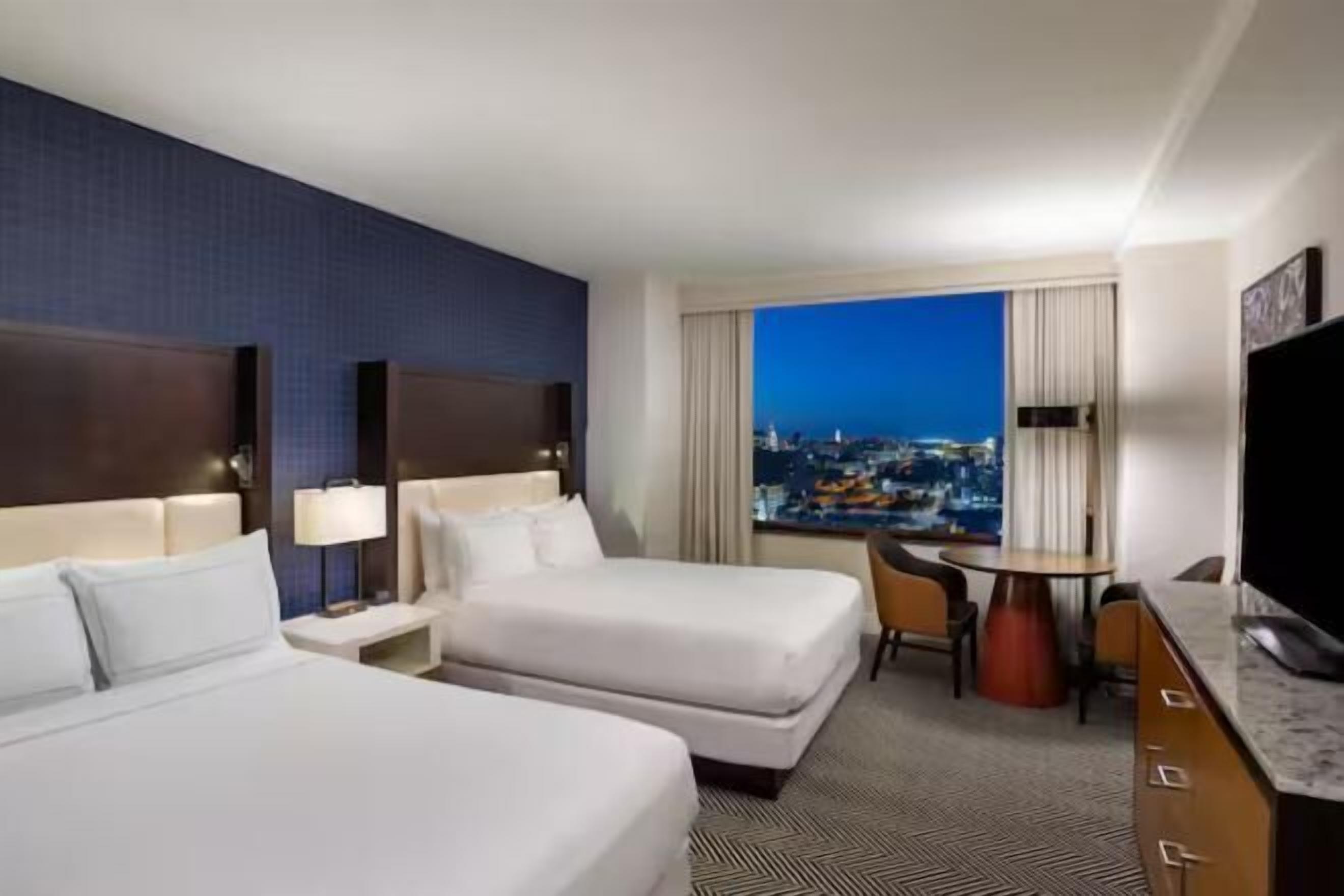 Premium bedding, pillow-top beds, in-room safe, laptop workspace