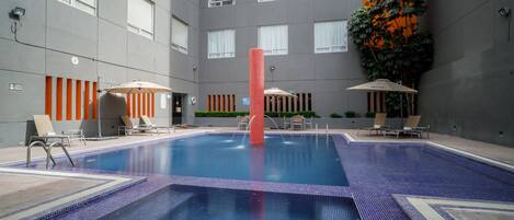 Outdoor pool, open 9:00 AM to 9:00 PM, pool loungers