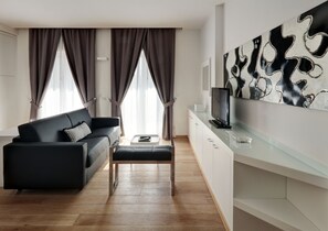 Superior Apartment | Living room | 32-inch TV with satellite channels