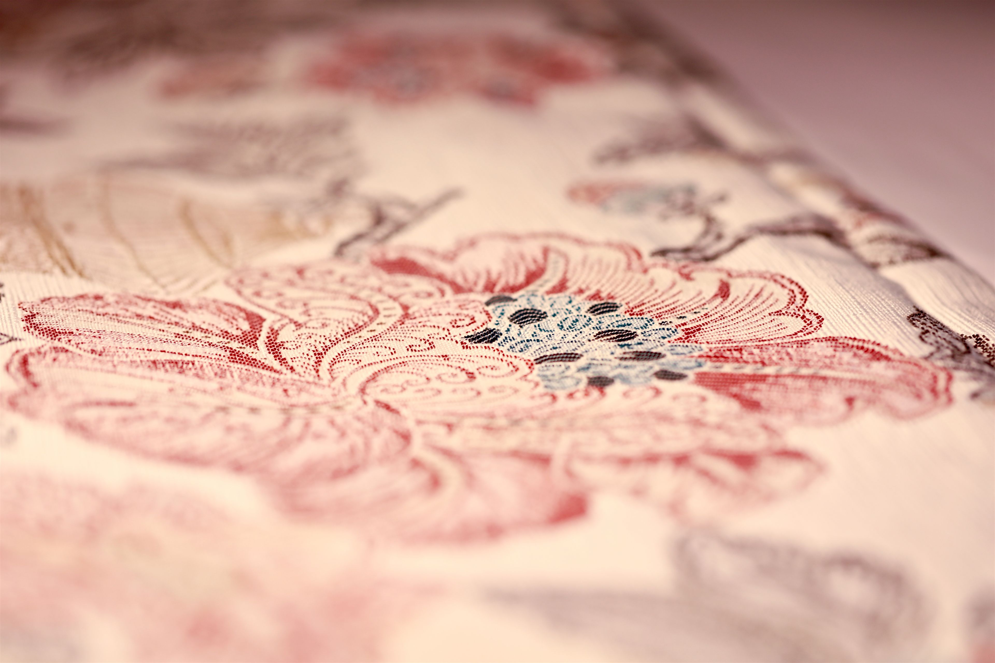 A close-up of a fabric with a floral pattern.