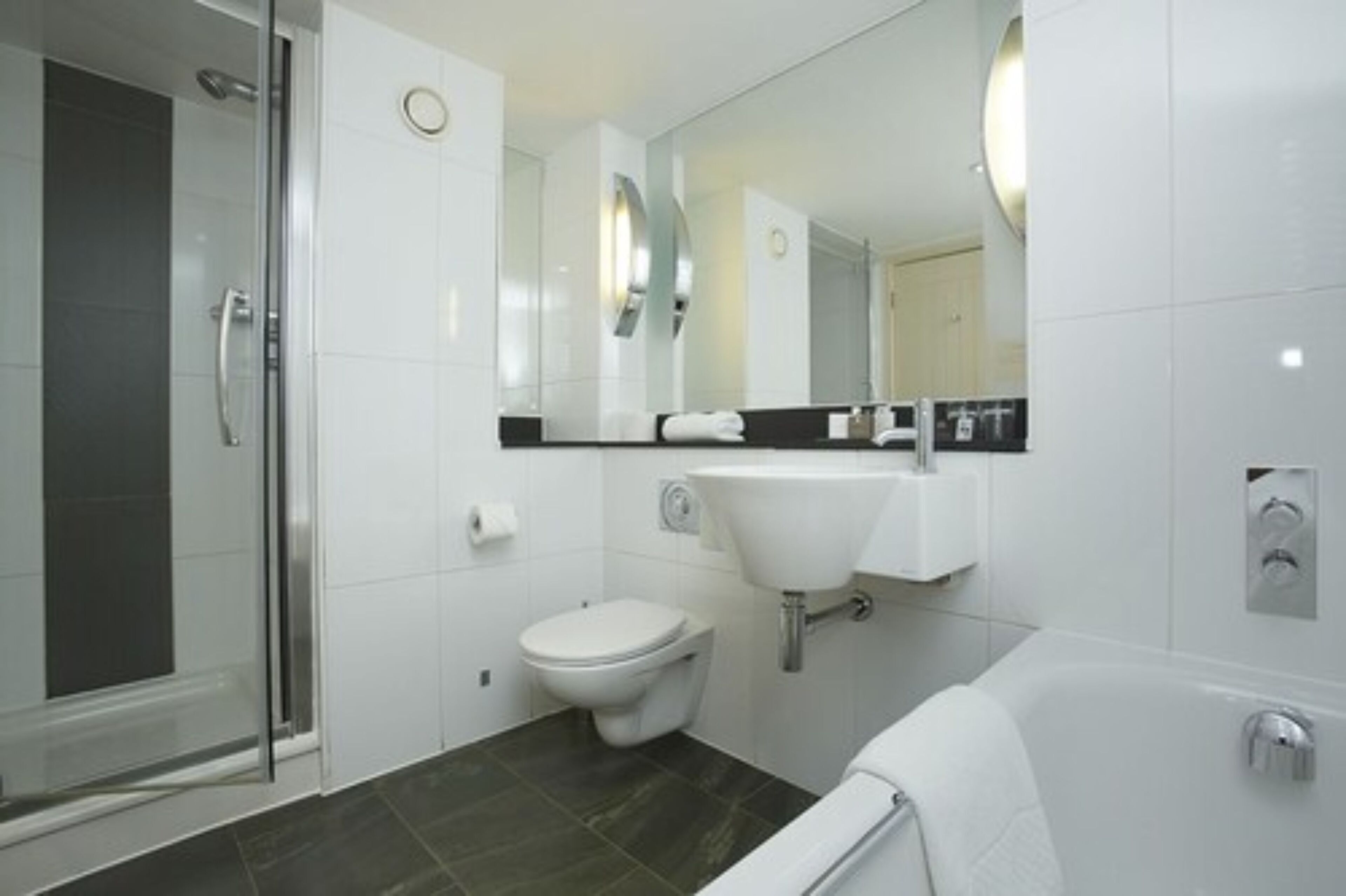 designer toiletries, hair dryer, towels