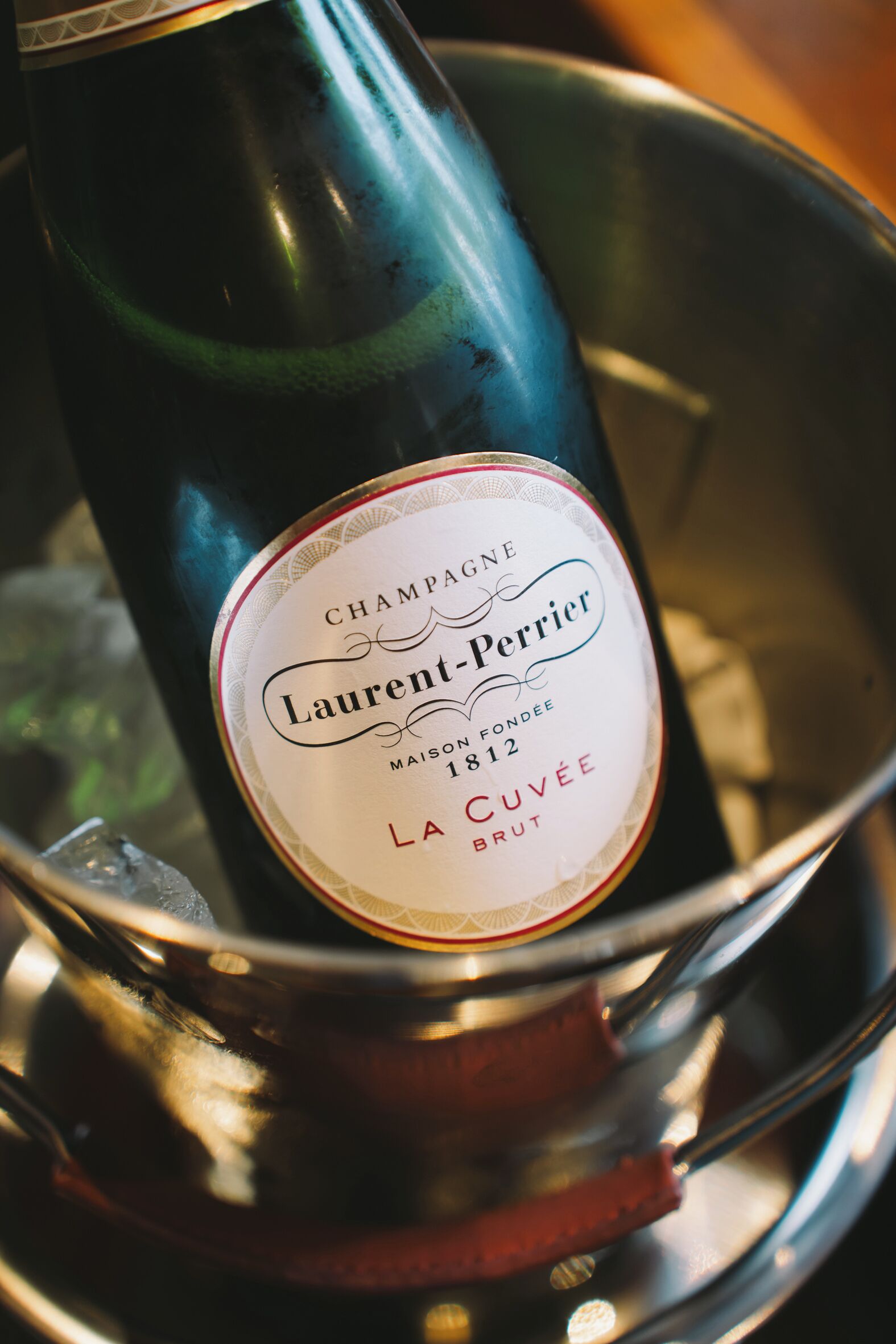 A bottle of champagne in a bucket.