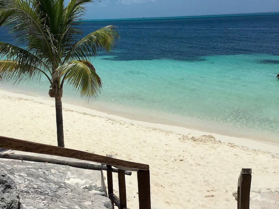 On the beach, white sand, sun loungers, beach umbrellas