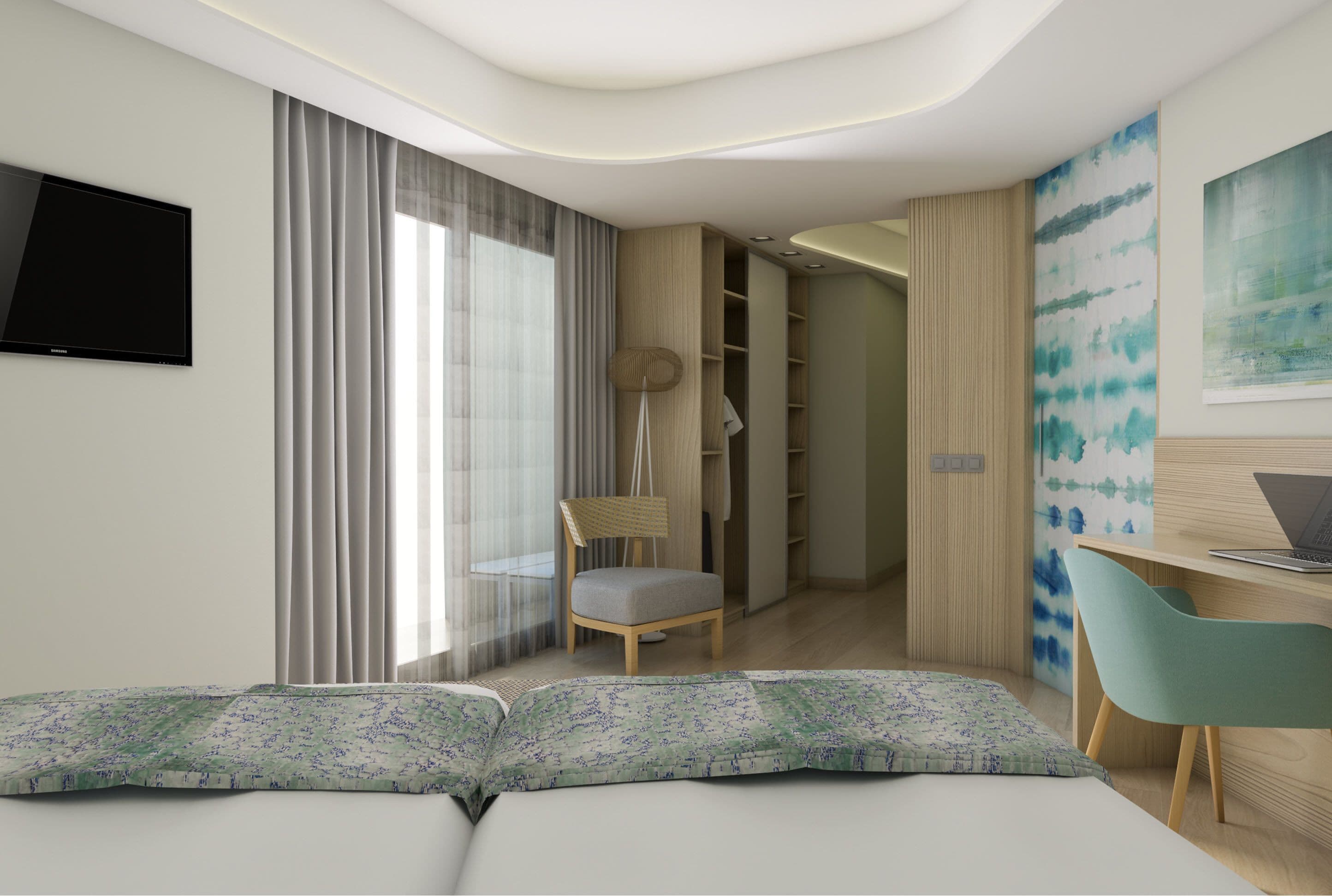 A modern hotel room with a sofa, a chair, a desk, a TV, and a wardrobe.