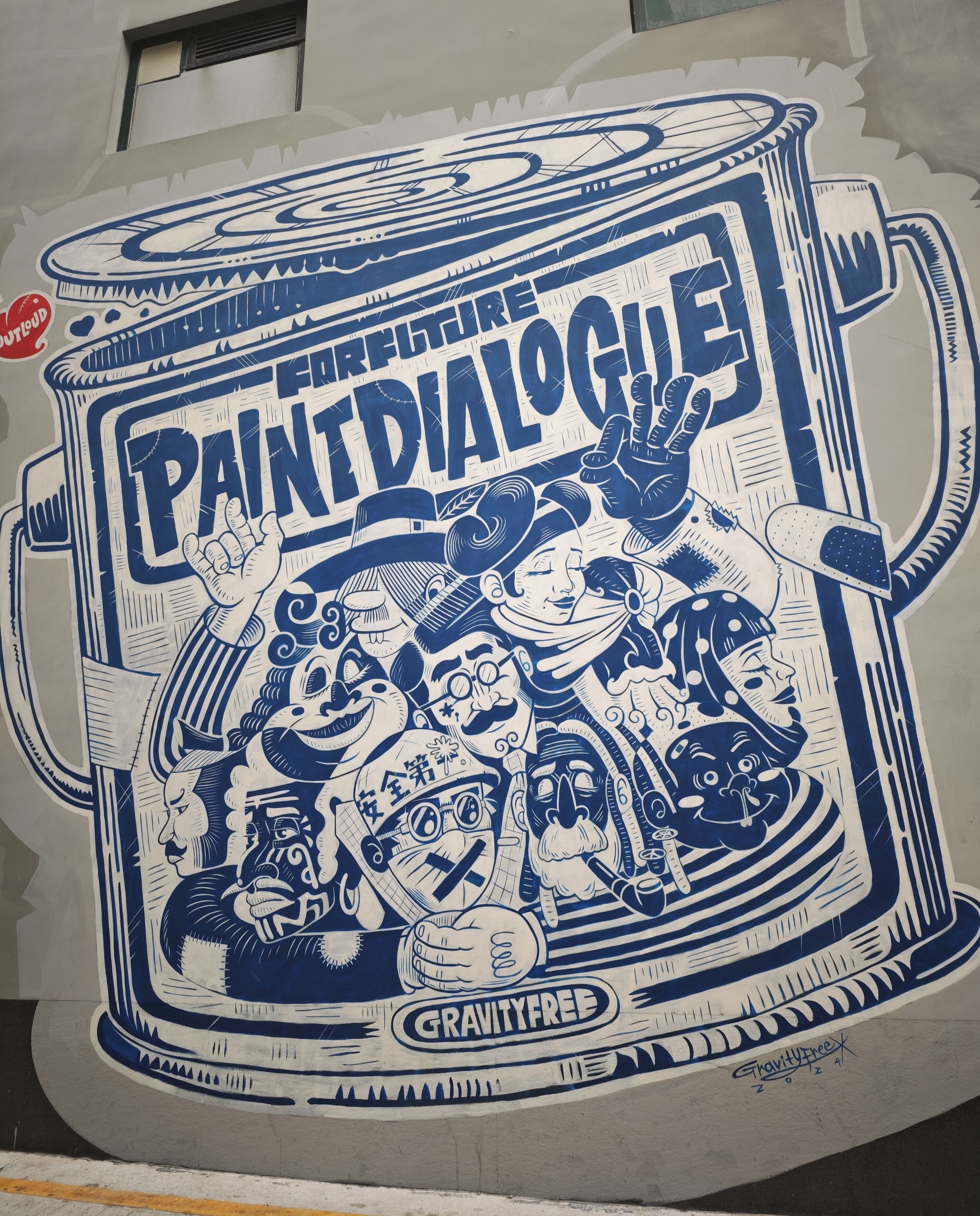 A mural of a paint can with the words "Paint Dialogue" and "GravityFree" on it.