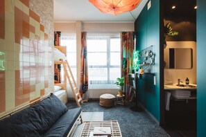 Quadruple Room | Living area | Flat-screen TV