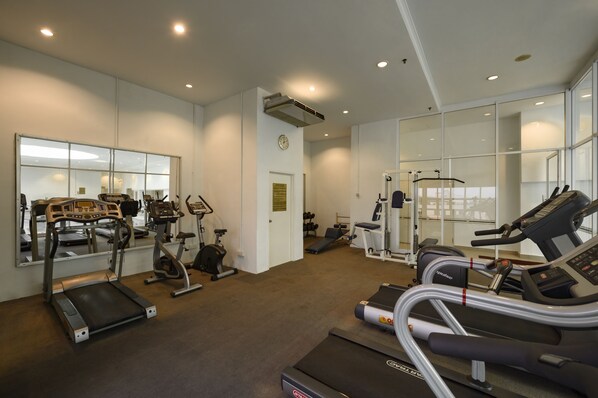A modern gym with treadmills, elliptical machines, and weight equipment. - Cititel Penang (George Town)