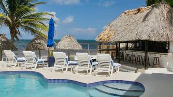 Outdoor pool, open 7 AM to 10 PM, pool umbrellas, sun loungers