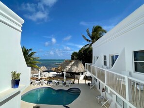 Outdoor pool, open 7 AM to 10 PM, pool umbrellas, sun loungers