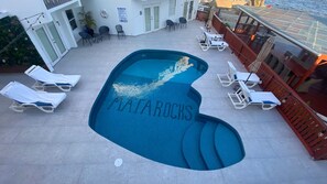 Outdoor pool, open 7 AM to 10 PM, pool umbrellas, pool loungers - Mata Rocks Resort (San Pedro)