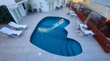 Outdoor pool, open 7 AM to 10 PM, pool umbrellas, sun loungers