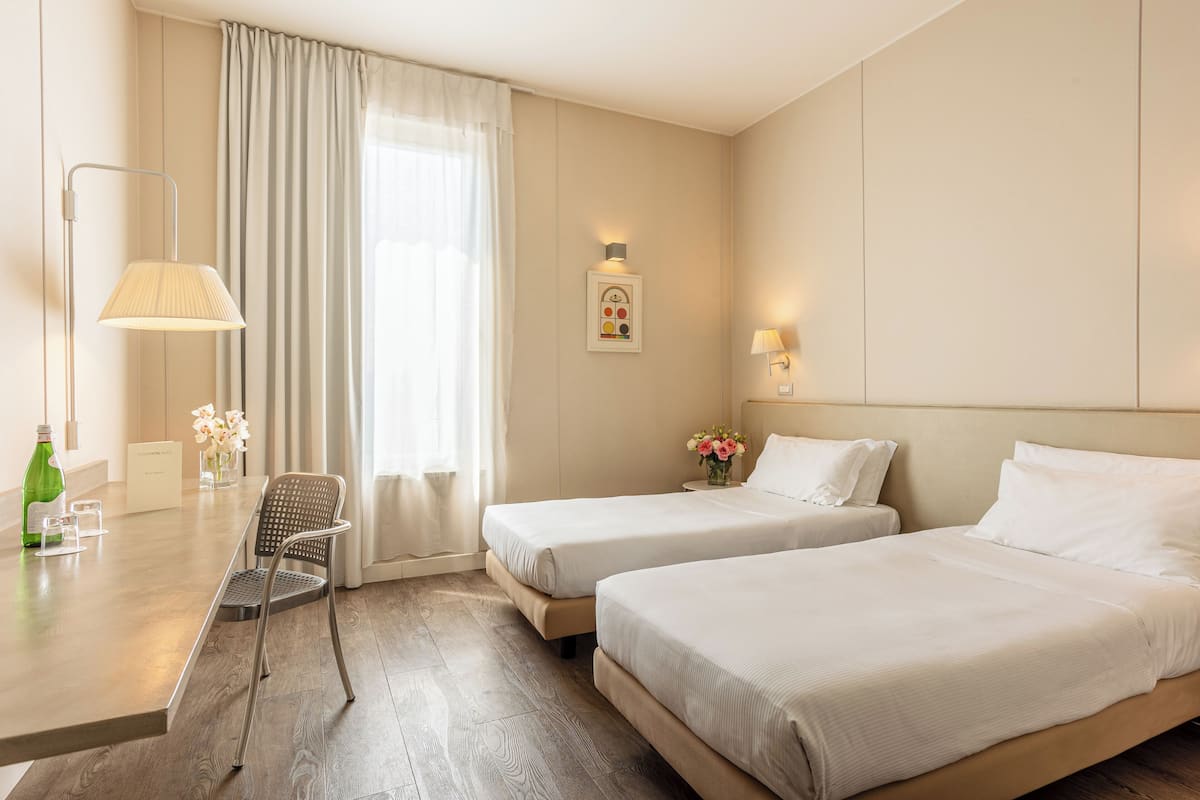 standard twin room | premium bedding, down duvets, in-room safe, desk