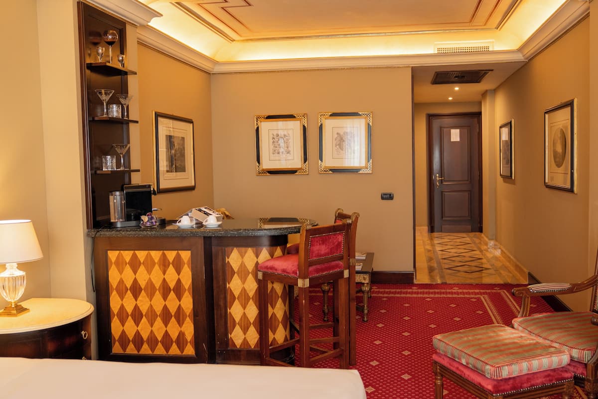 Family Junior Suite | Living area | 40-inch flat-screen TV with digital channels