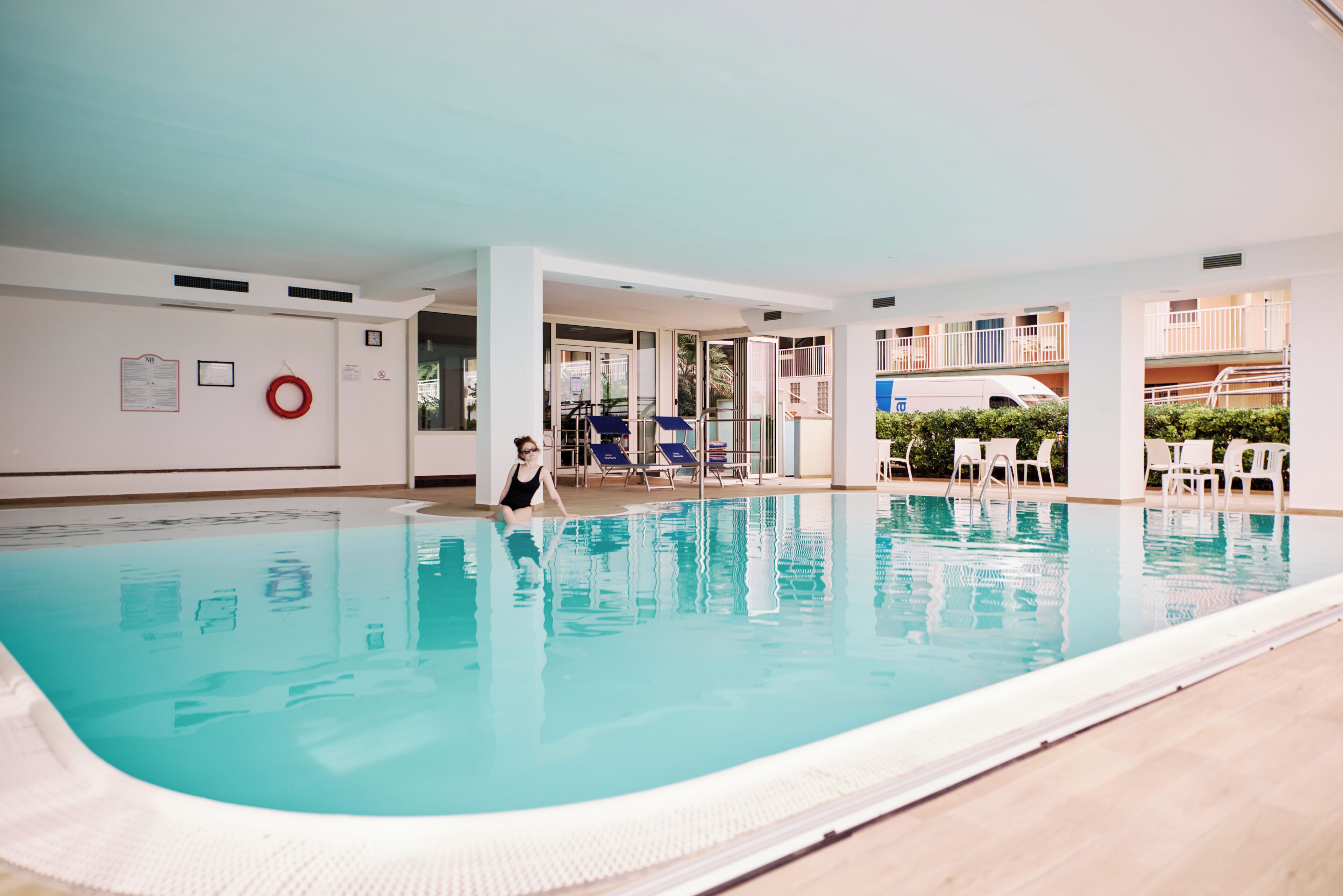 indoor pool, open 8:00 am to 7:00 pm, pool loungers