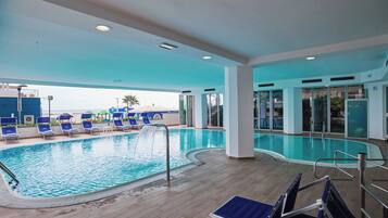 Indoor pool, open 8:00 AM to 7:00 PM, pool loungers