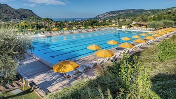 Seasonal outdoor pool, open 10:00 AM to 6:00 PM, pool umbrellas