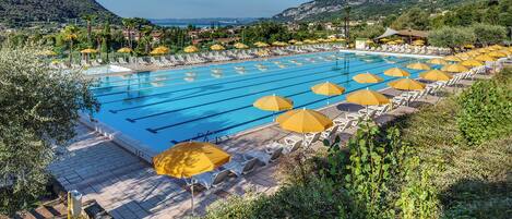 Seasonal outdoor pool, open 10:00 AM to 6:00 PM, pool umbrellas