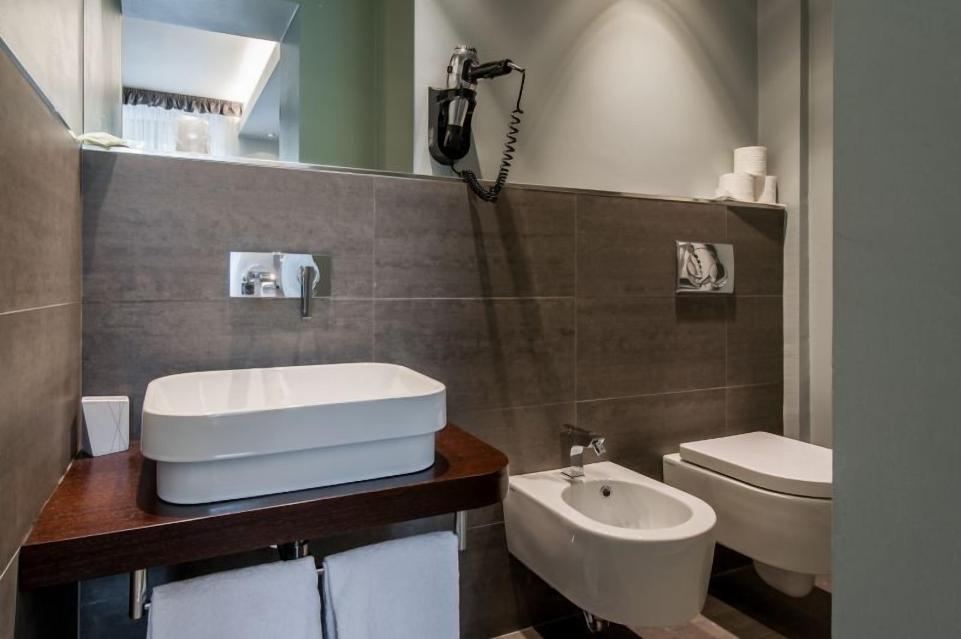 family room | bathroom | shower, free toiletries, hair dryer, slippers