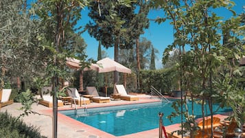 Seasonal outdoor pool, pool umbrellas, pool loungers