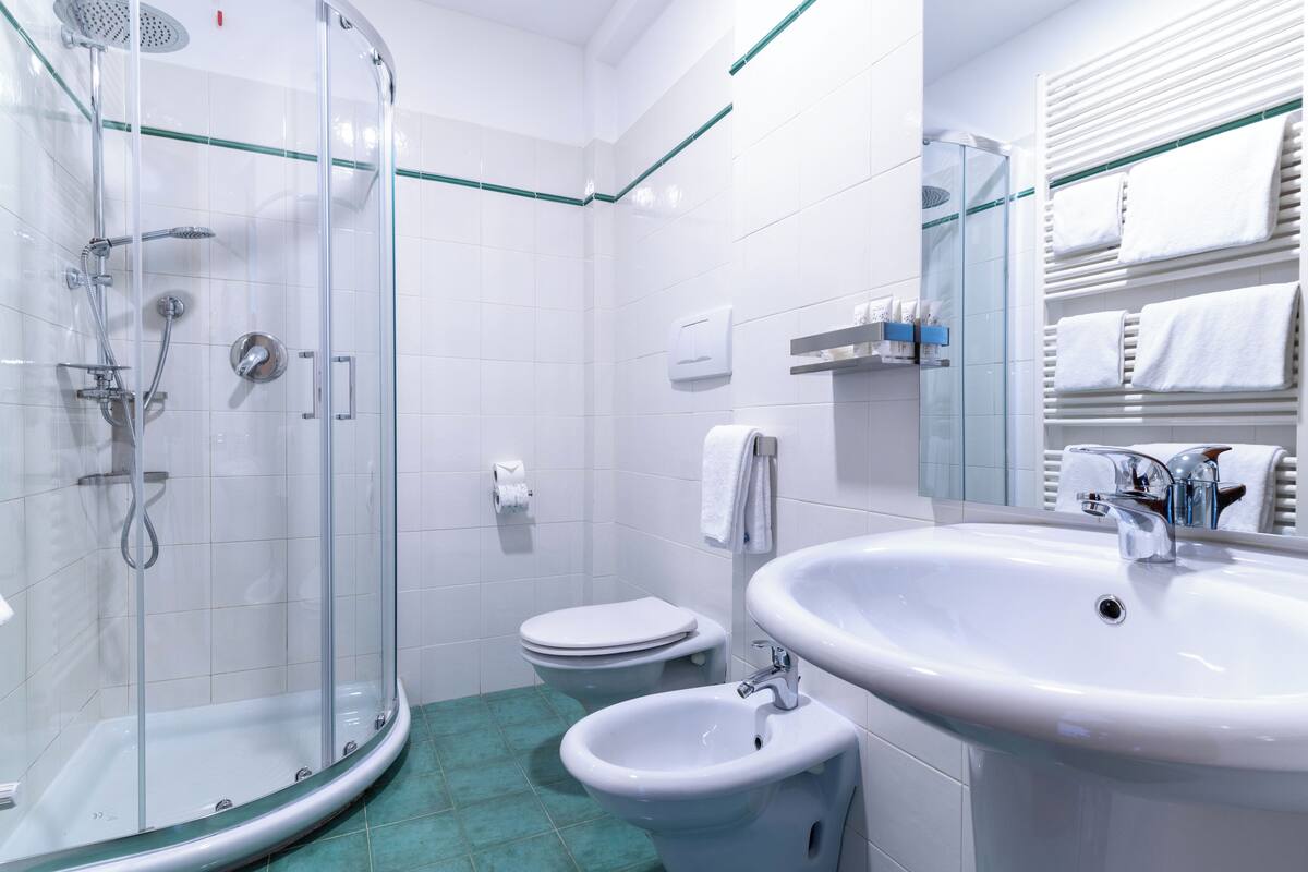 basic triple room | bathroom | shower, rainfall showerhead, hair dryer, bathrobes