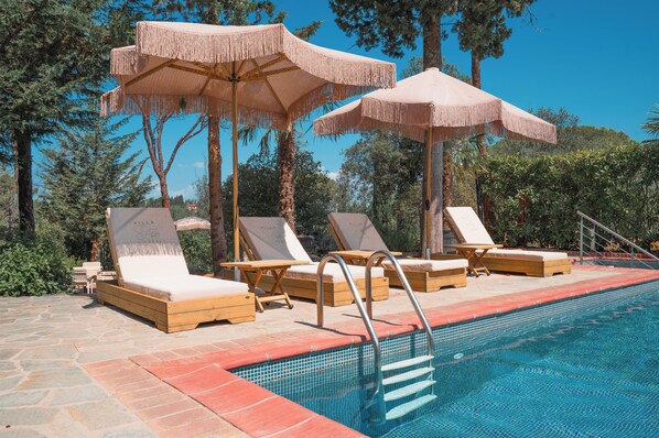 Seasonal outdoor pool, pool umbrellas, pool loungers