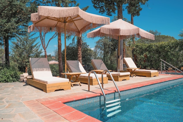 Seasonal outdoor pool, pool umbrellas, pool loungers