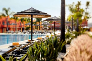 2 outdoor pools, open 9:00 AM to 7:00 PM, pool loungers