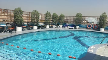 Outdoor pool, pool umbrellas, pool loungers