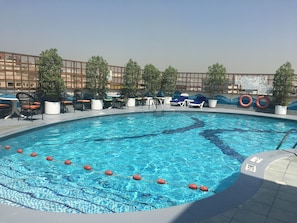 Outdoor pool, pool umbrellas, sun loungers