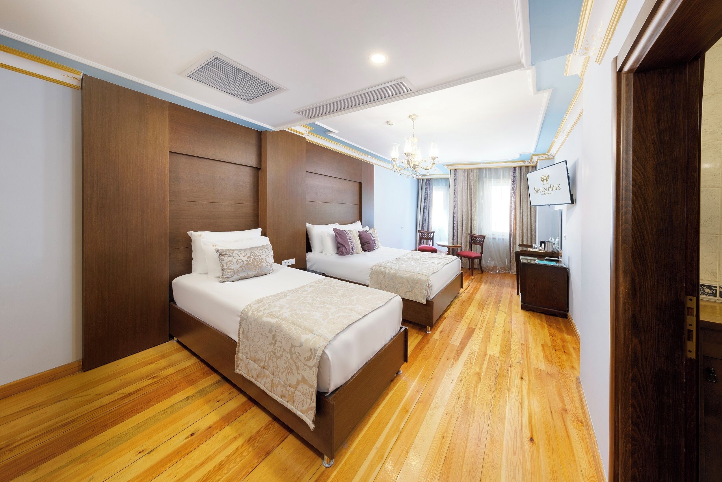 Superior Triple Room | Minibar, in-room safe, individually decorated, individually furnished