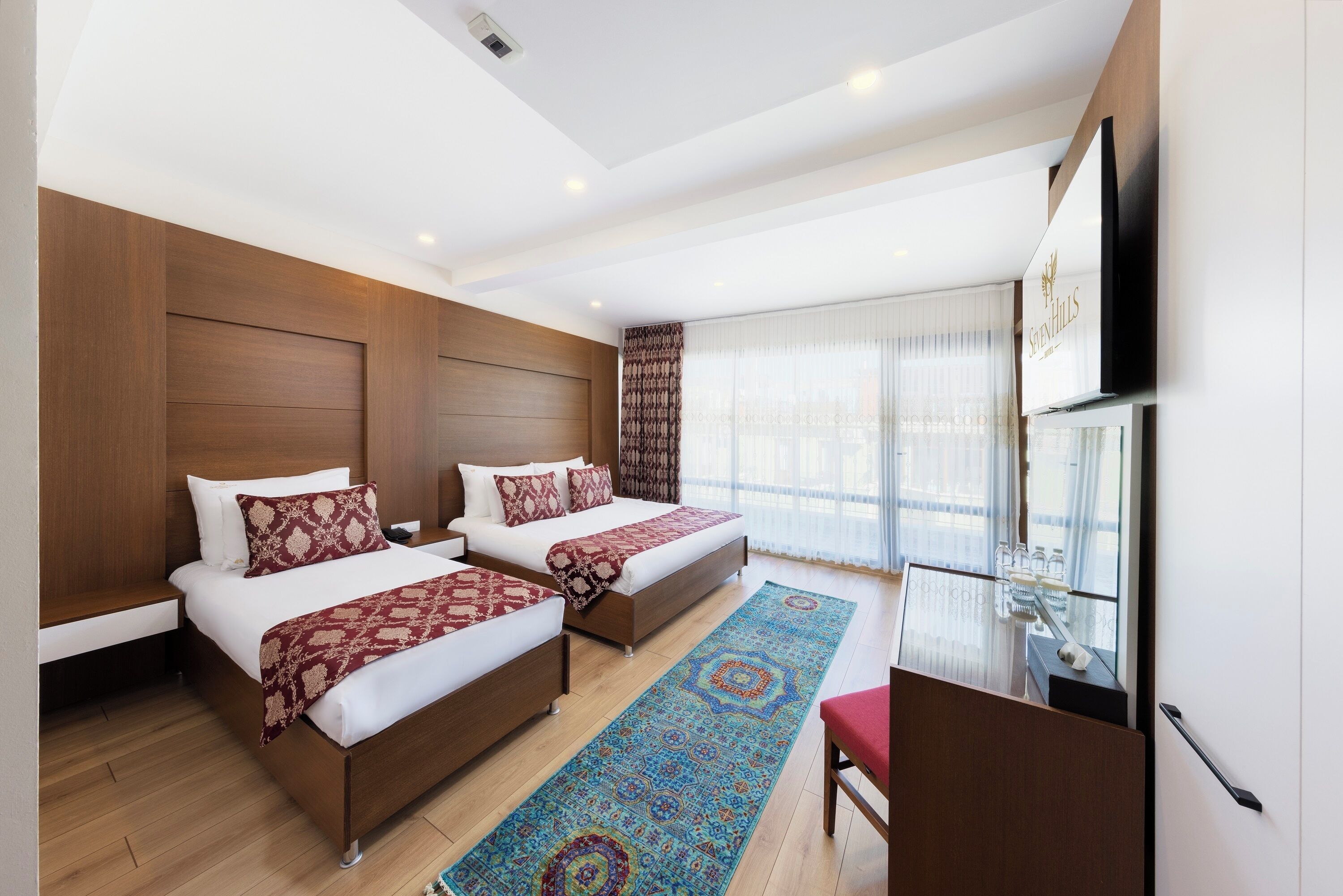 Deluxe Family Room | Minibar, in-room safe, individually decorated, individually furnished