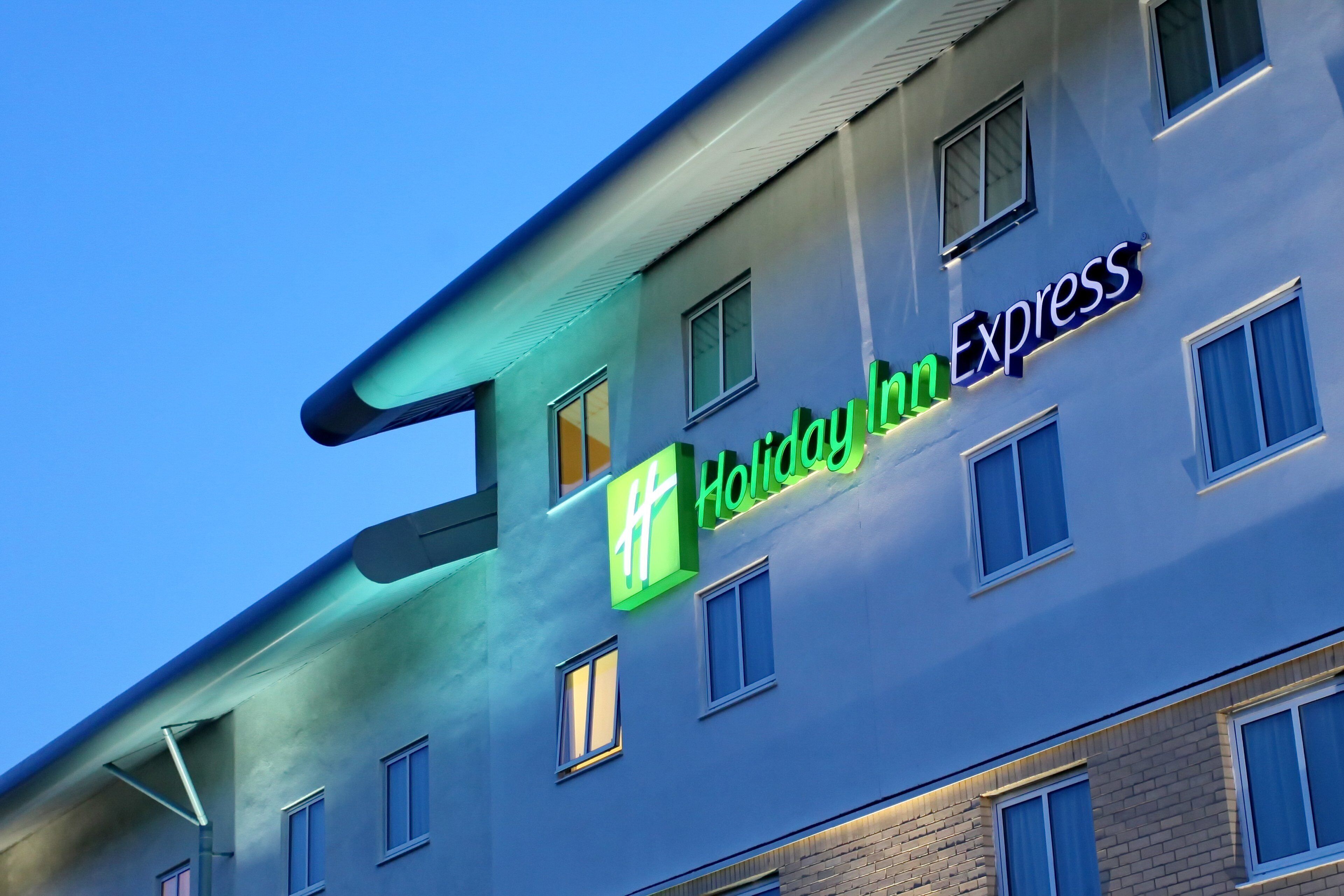 A hotel building with a Holiday Inn Express sign.