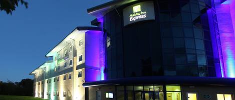 A Holiday Inn Express hotel with a modern design, featuring a prominent entrance and signage.